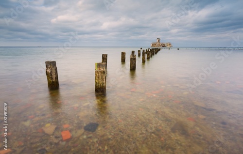 Beautiful view on Baltic sandy coast with old military buildings photo