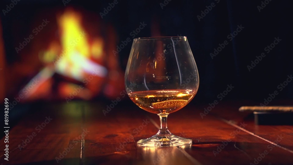 Cognac. Pouring Brandy from a Bottle to a Glass Cognac. Pouring Brandy from a Bottle to a Glass