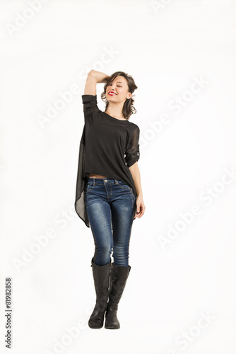 Full length of attractive young woman posing on white