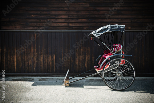 Japanese Rickshaw with wooden wall in Takayama Old town japan