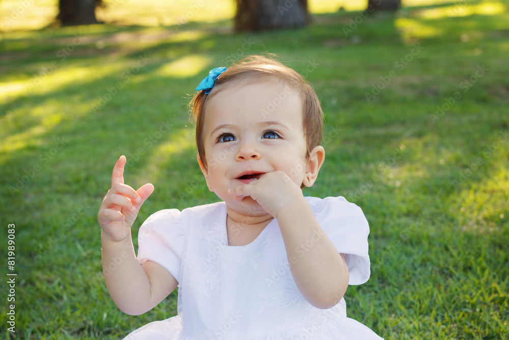 Cute happy baby girl smiling, scratching first teeth Cute happy baby girl smiling, scratching first teeth