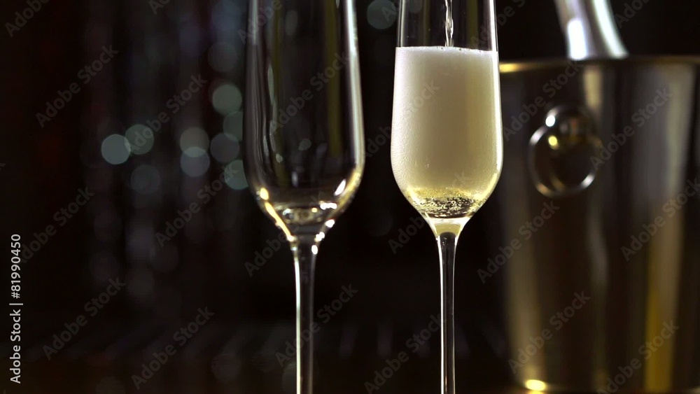 Flutes with sparkling champagne closeup. Slow motion Flutes with sparkling champagne closeup. Slow motion