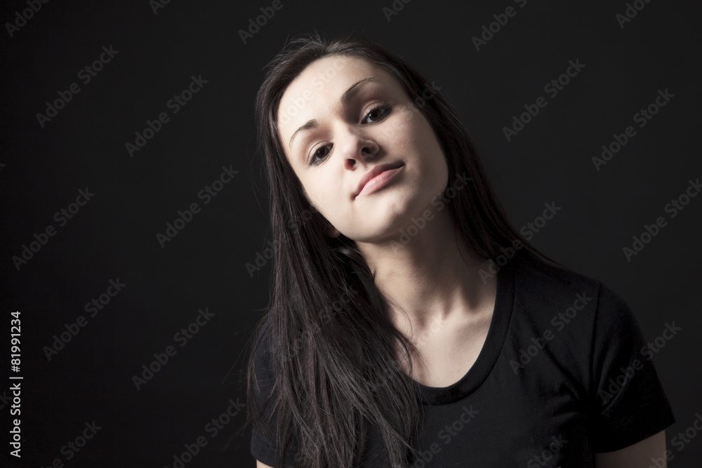 Young stylish trendy teenager over black background