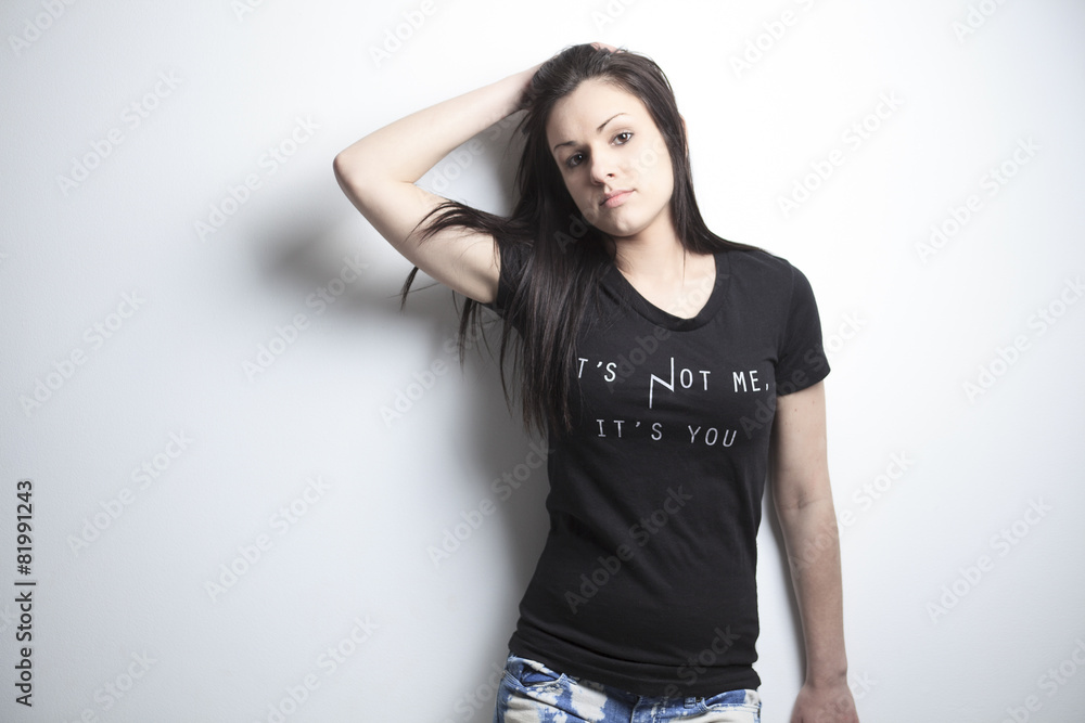 Portrait of woman posing over grey background. Portrait of woman posing over grey background.
