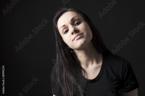 Young stylish trendy teenager over black background