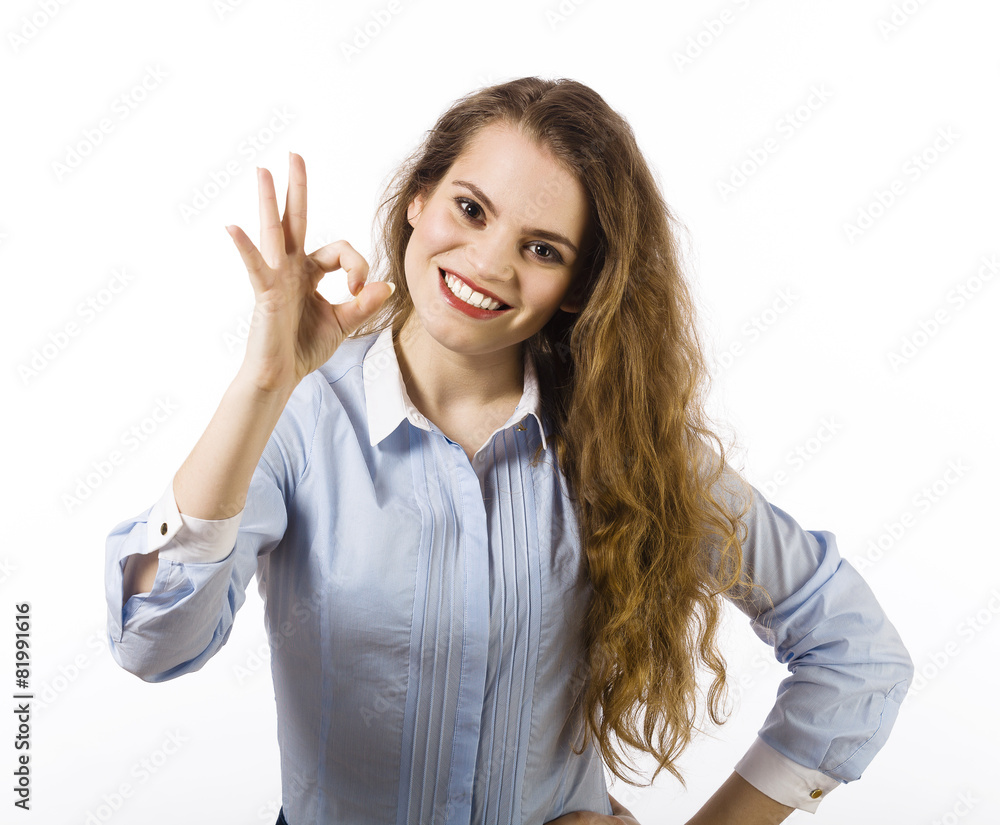 Portrait of a beautiful smiling young woman dressed in a blue sh Portrait of a beautiful smiling young woman dressed in a blue sh