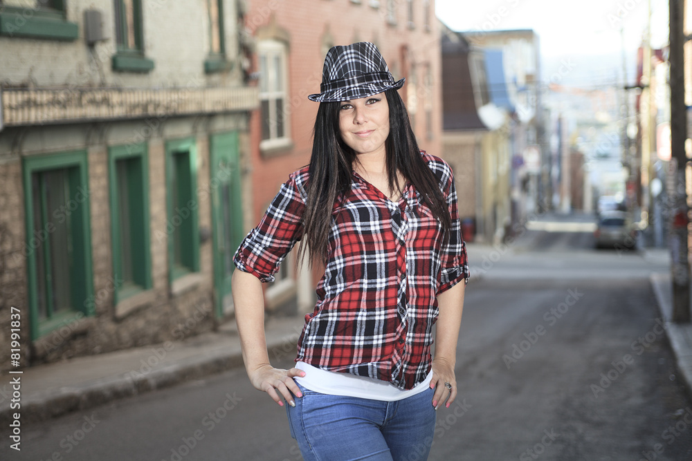 Fototapeta premium Cheerful woman in the street walking