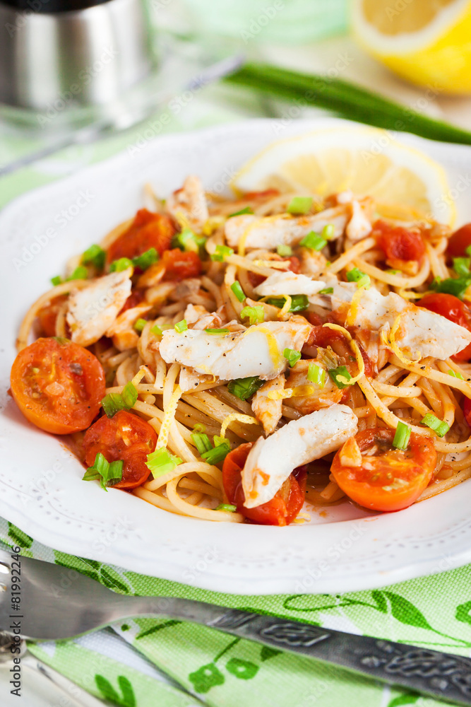 Fresh delicious pasta with fish and tomato sauce Fresh delicious pasta with fish and tomato sauce