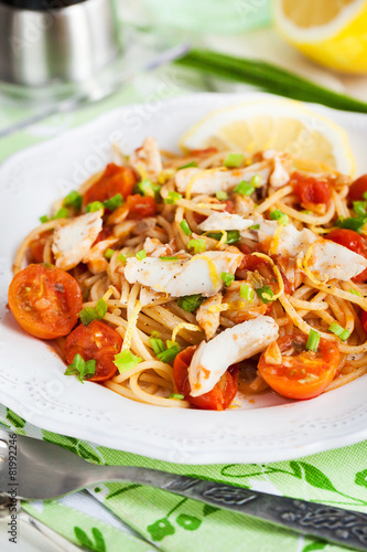 Fresh delicious pasta with fish and tomato sauce
