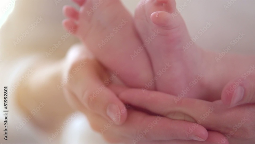 Baby feet in mother hands. Slow motion 240 fps. Full HD 1080p Baby feet in mother hands. Slow motion 240 fps. Full HD 1080p