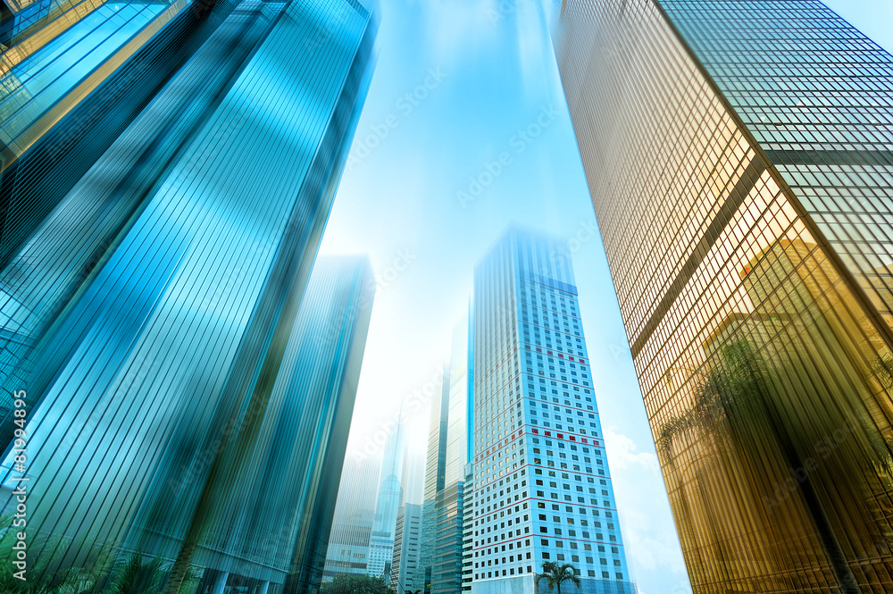 low angle view of skyscrapers in blurred motion.