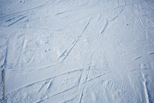 Traces of skis and shoe on the snow