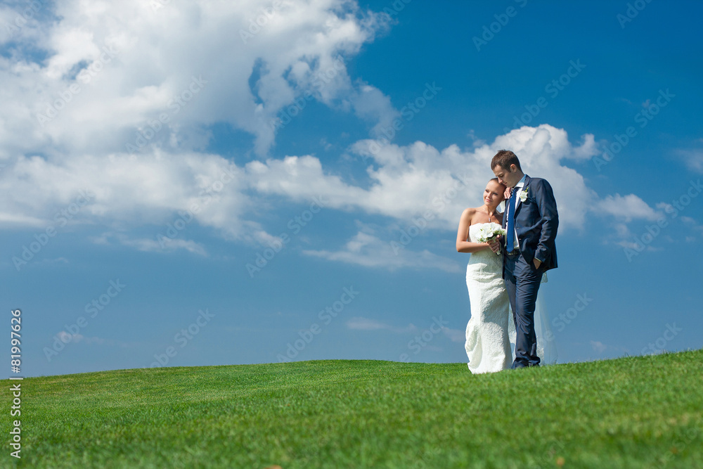 Just married couple on a background of blue sky