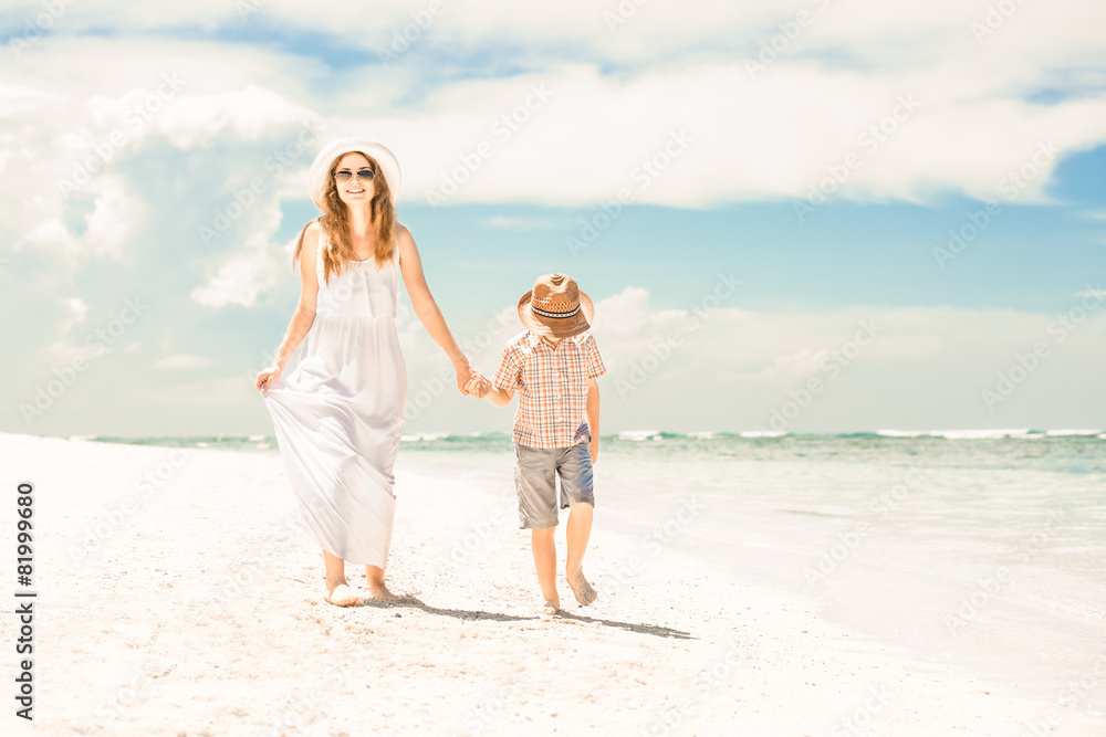 Happy beautiful mother and son enjoying beach time Happy beautiful mother and son enjoying beach time