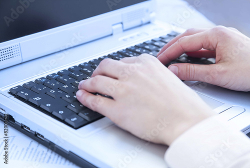 Hands Typing on Computer Keyboard at Office