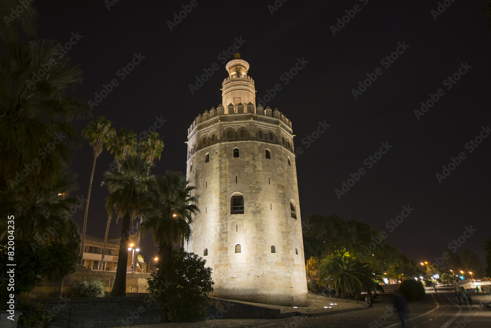 Night view of the Gold Tower in Seville, Spain.