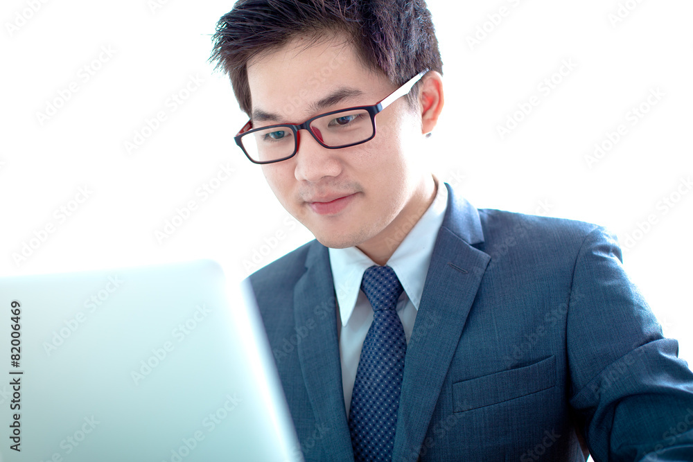 Handsome businessman working with laptop Handsome businessman working with laptop