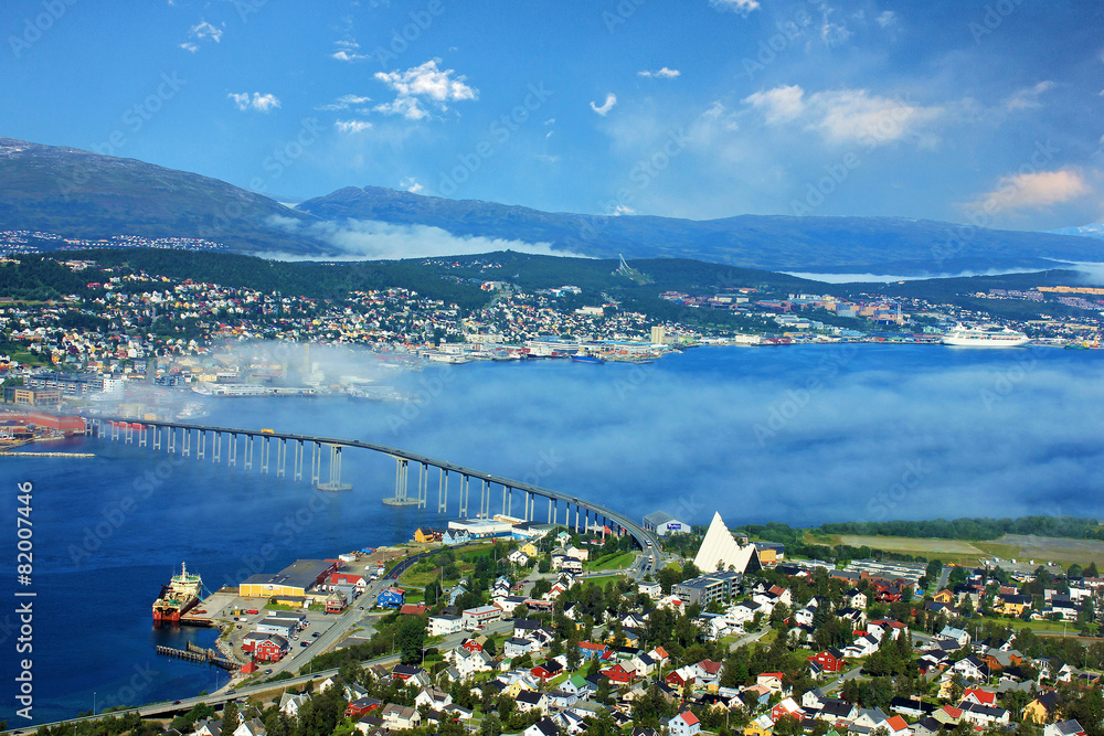 Panoramic sea view from mountain on Norwegian city Tromso beyond