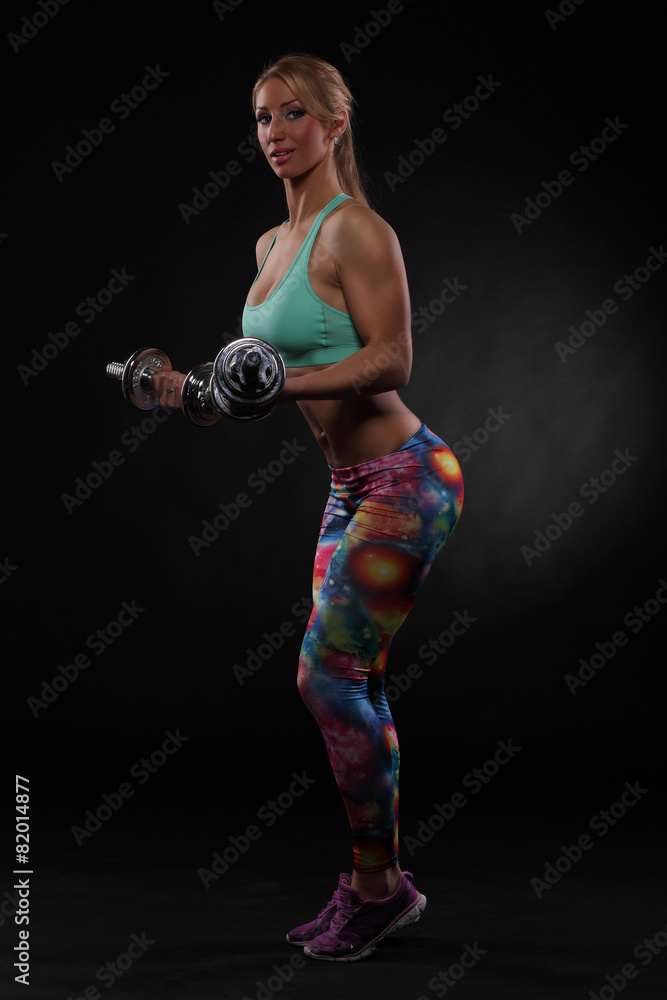 Athletic  woman doing workout with weights
