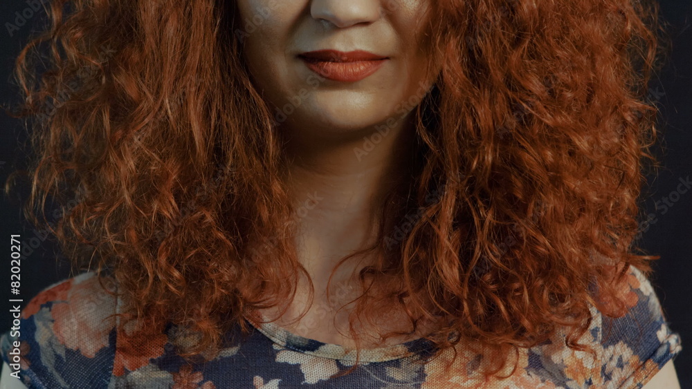 A Beautiful red-haired girl's. Natural hairstyle. Close up A Beautiful red-haired girl's. Natural hairstyle. Close up