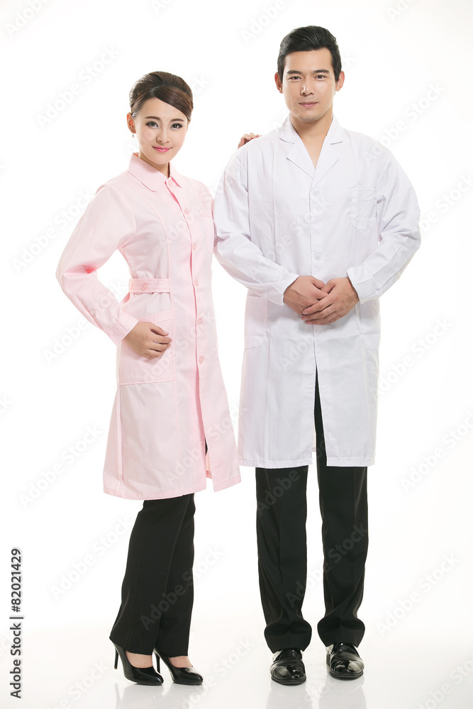 Staff wear coats in front of white background Staff wear coats in front of white background