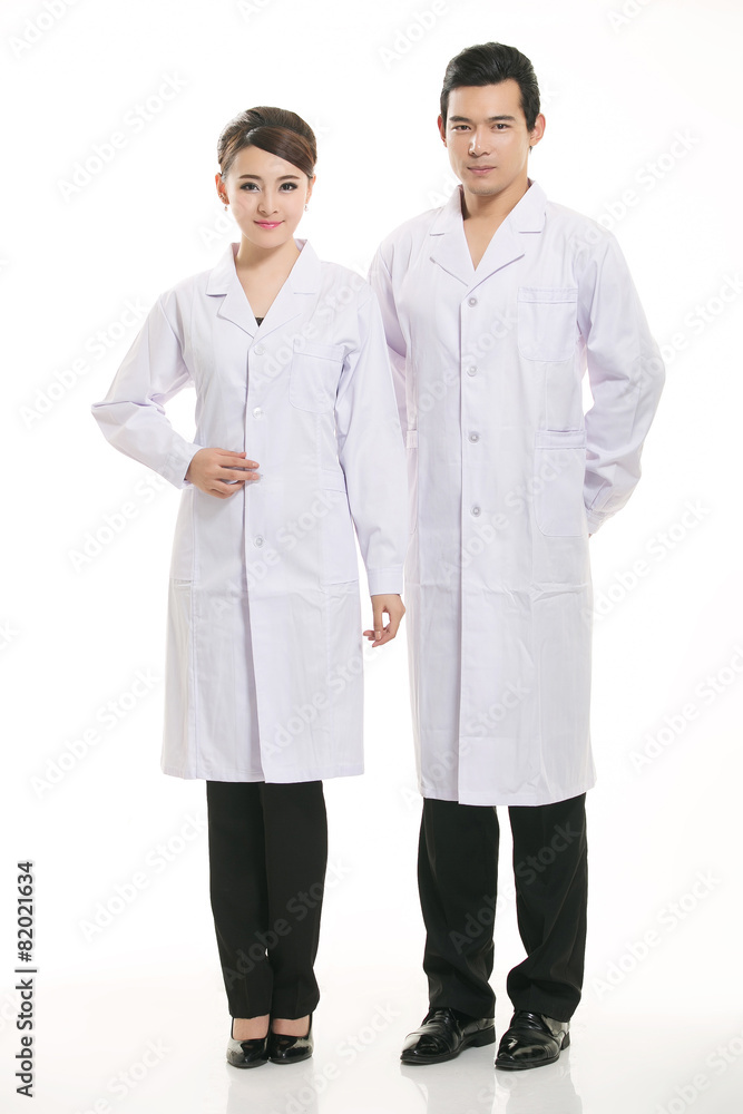 Staff wear coats in front of white background Staff wear coats in front of white background