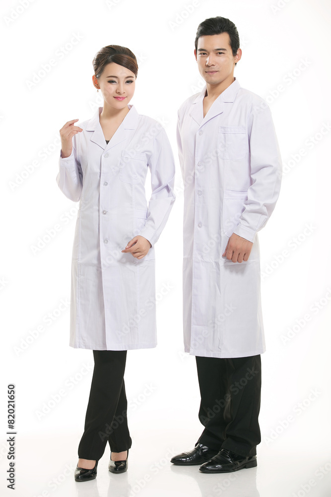 Staff wear coats in front of white background Staff wear coats in front of white background