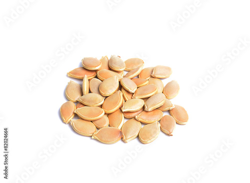 Dried pumpkin seeds on white background