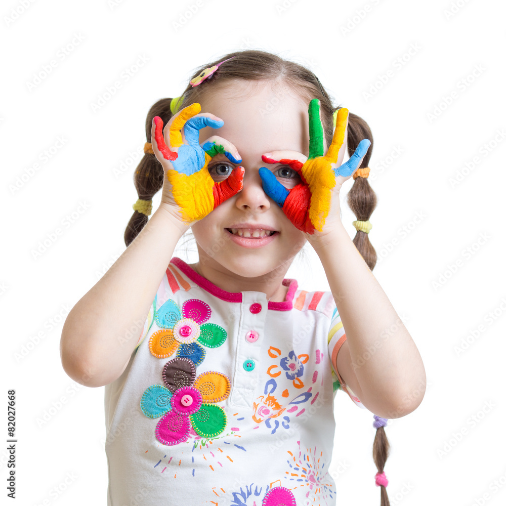 Four year old child girl with hands painted in color paints Four year old child girl with hands painted in color paints