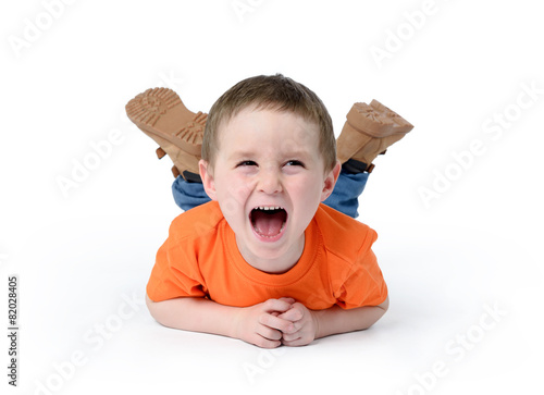 Happy child laughing on white background