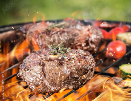 Beef steaks on grill