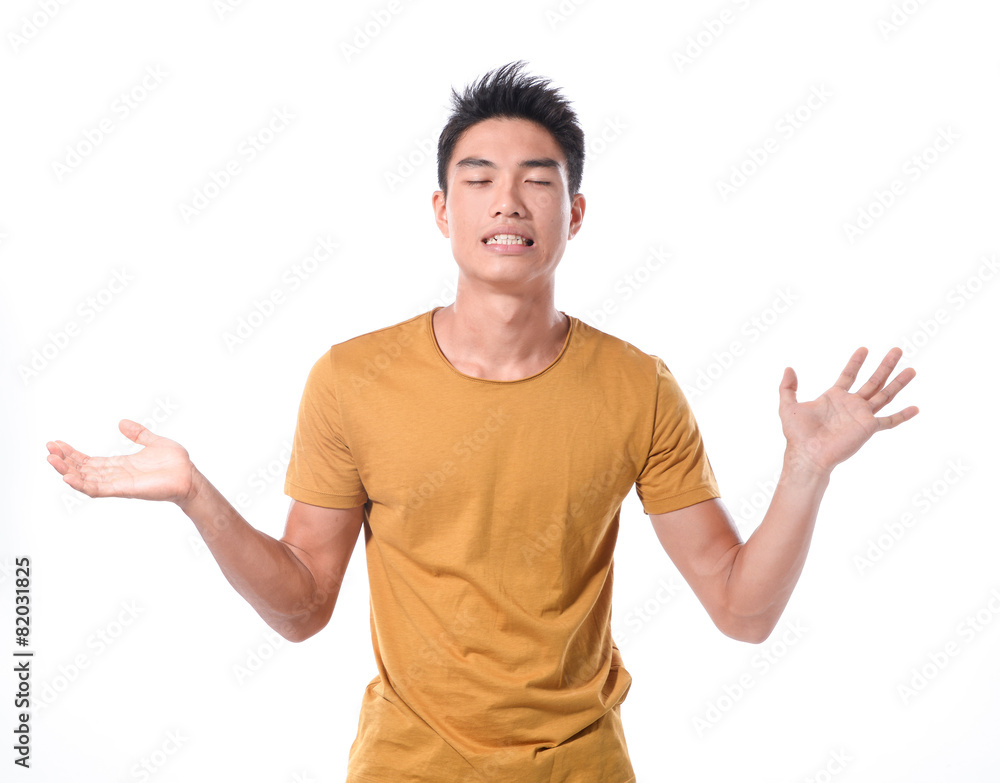 Closeup portrait of wild, goofy, crazy, funny, shocked surprised stunned young man face with hands in air Closeup portrait of wild, goofy, crazy, funny, shocked surprised stunned young man face with hands in air