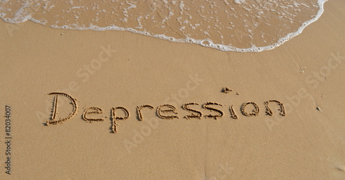 Text 'Depression' in the sand