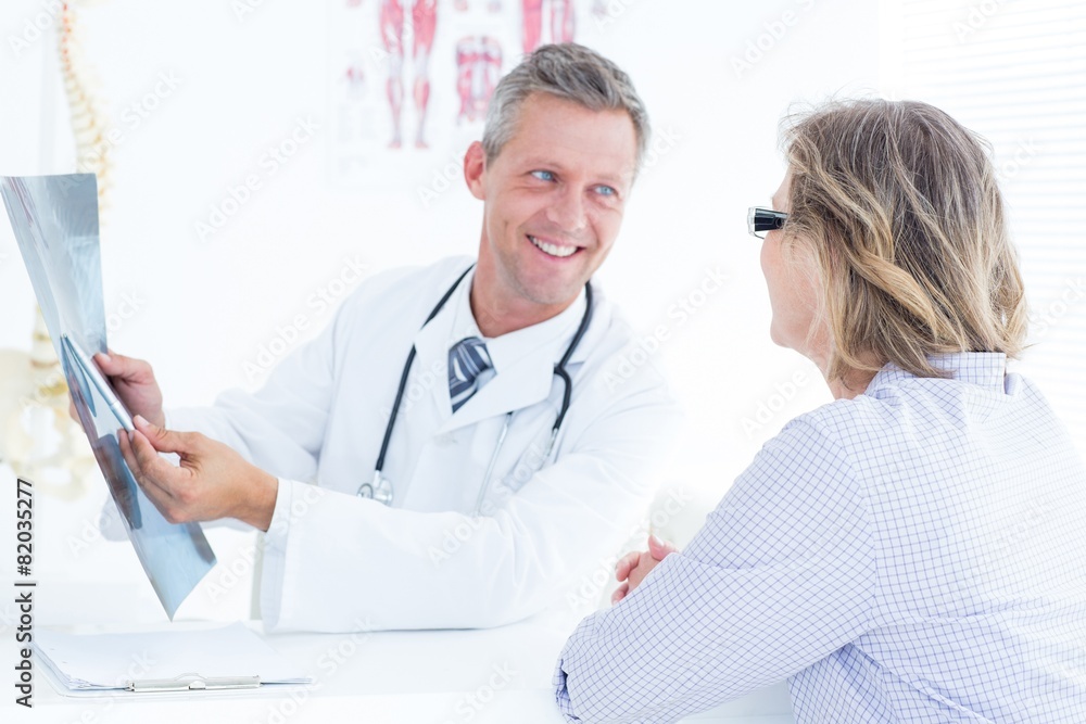 Doctor showing xray to his patient Doctor showing xray to his patient