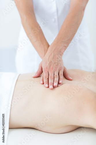 Physiotherapist doing back massage