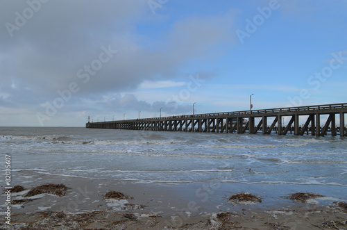 long pier into sea on Belgian coast © lembrechtsjonas