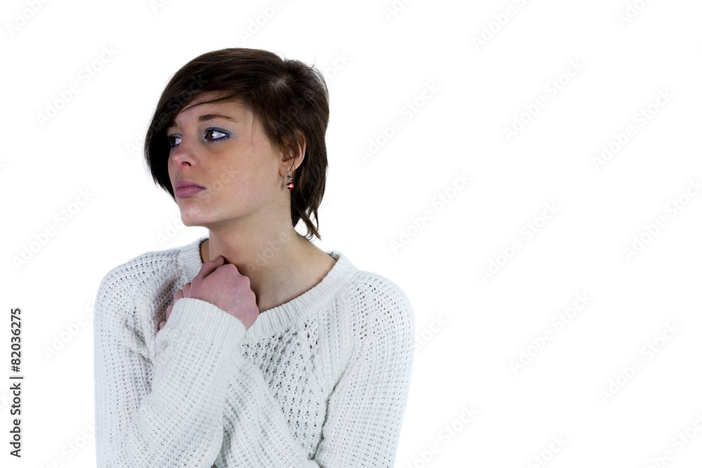 Sad pretty brunette thinking with arms crossed Sad pretty brunette thinking with arms crossed