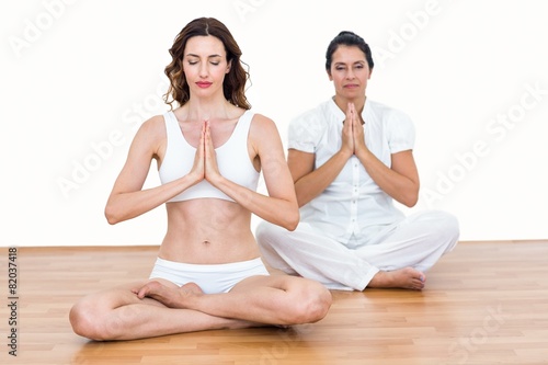 Women sitting in lotus pose