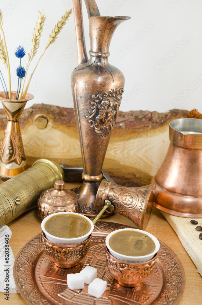 Copper plates and cups filled with coffee