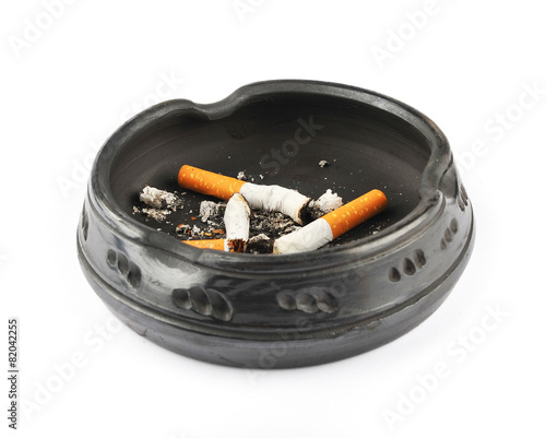 Three extinguished cigarettes in a black ashtray