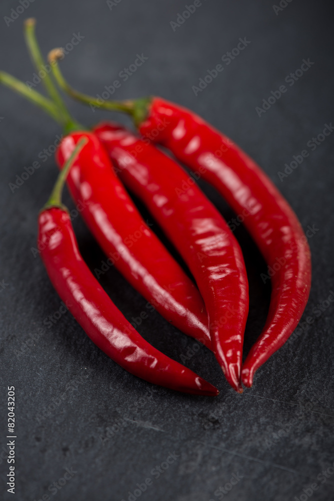 Burning hot vibrant red mexican chilli peppers