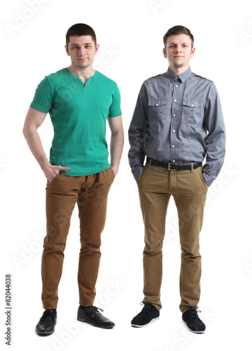 Two handsome young men isolated on white