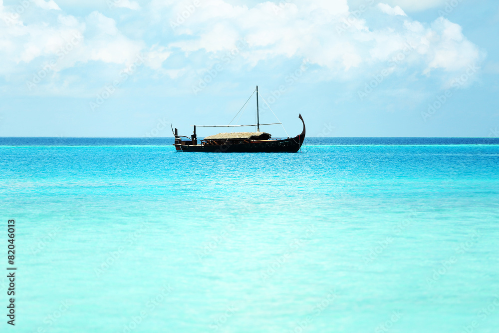 View of beautiful blue ocean water with ship in resort View of beautiful blue ocean water with ship in resort