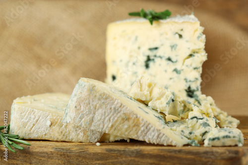 Blue cheese on wooden cutting board. closeup