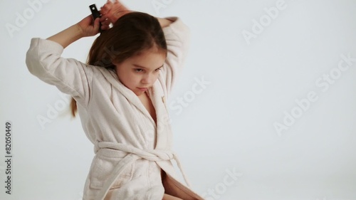 Girl combing and dry hair