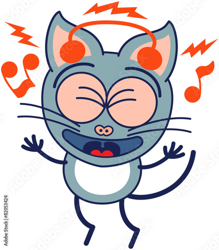 Enthusiastic gray cat with headphones listening to music