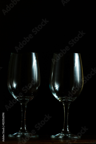 Empty wine glasses on black background
