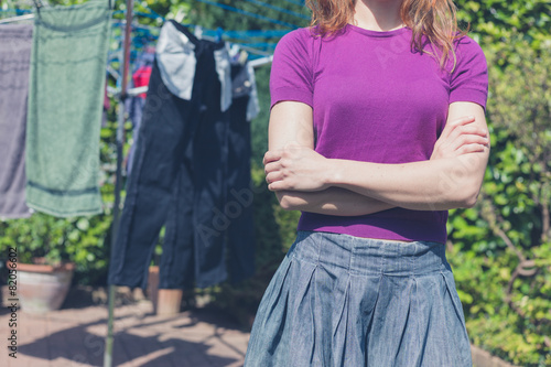 Woman with her laundry outside in garden