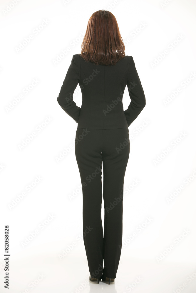 Fototapeta premium Young Asian women wearing a suit in front of a white background