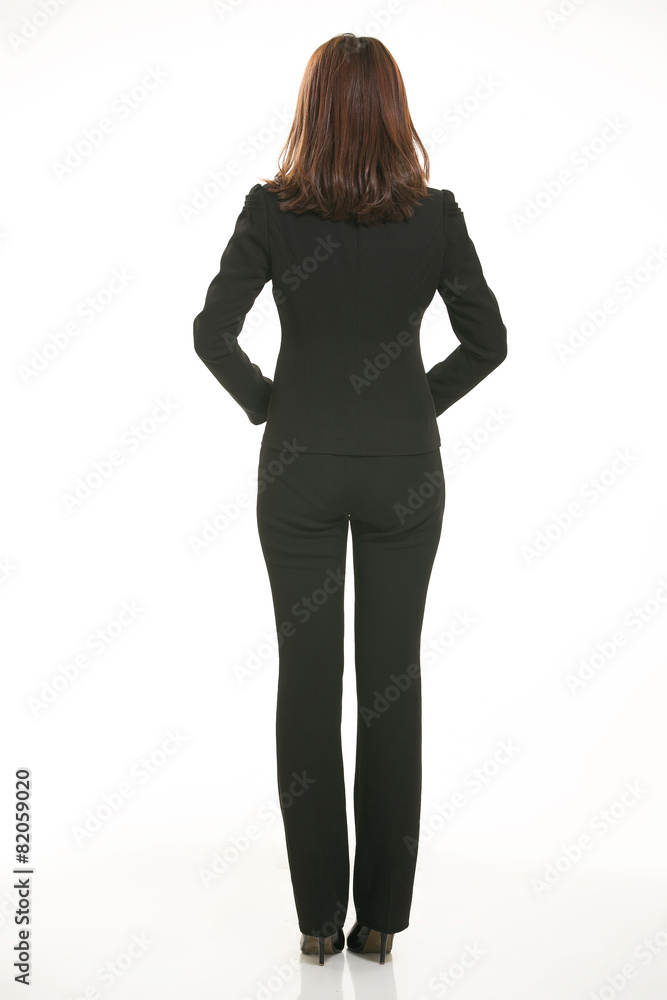 Young Asian women wearing a suit in front of a white background Young Asian women wearing a suit in front of a white background